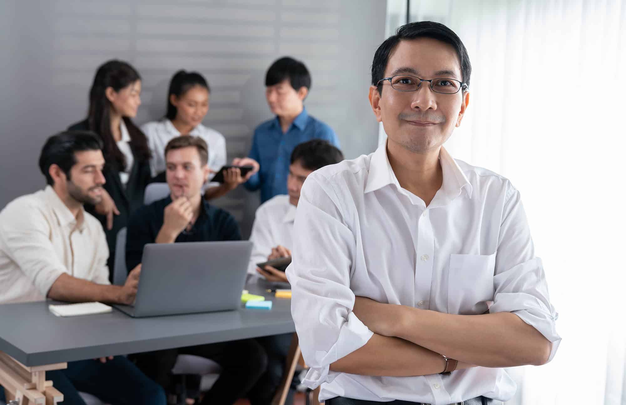 A team of professionals from an outsourced maintenance company gathered in a meeting room.